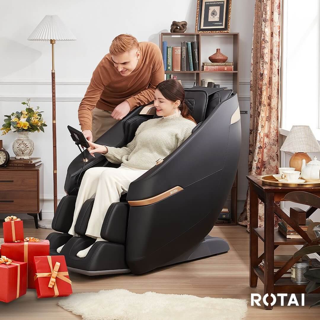 Black Ekanite 2 in 1 Massage Chair and Sofa in a cozy room with people, highlighting comfort and style with a 10-year warranty.