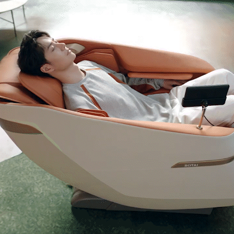 Man relaxing in a Jimny Massage Chair with 1-Press Start Rocking feature, in a modern room, best massage chair UAE, massage chair Dubai